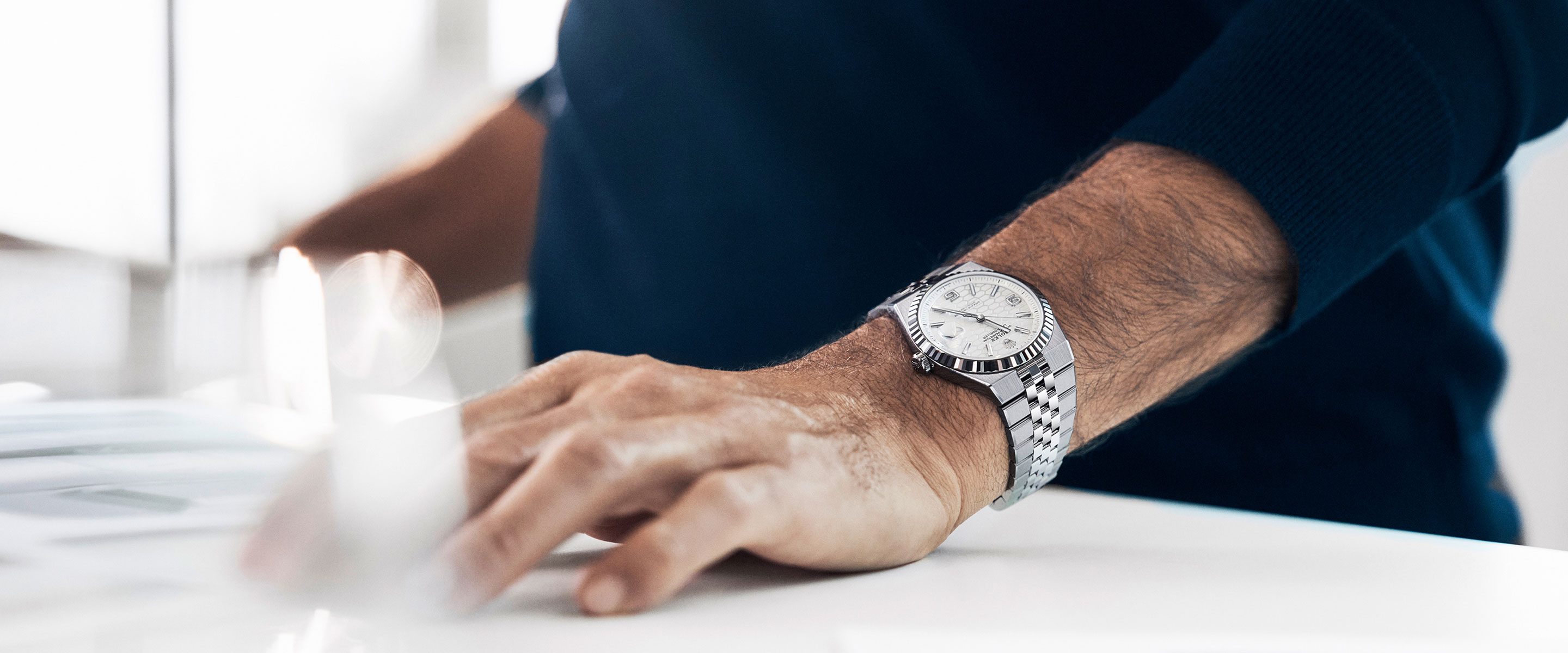 Ambassador with wrist watch