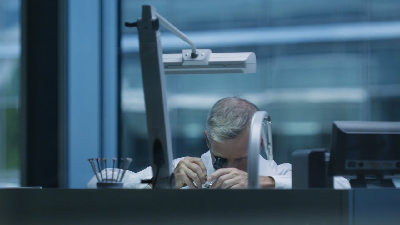 Rolex watchmaker at work in workshop